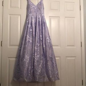 Hello! I’m selling this Prom Dress and it’s a lavender color. Only worn once